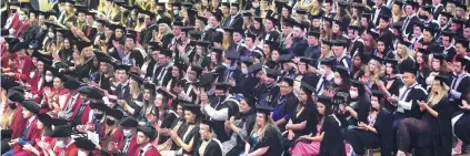  ?? PHOTOS: PETER MCINTOSH ?? Celebratin­g achievemen­t . . . Graduates sit during the 1pm graduation ceremony on Saturday.