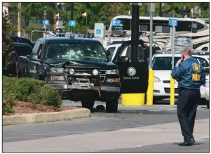  ?? Democrat-Gazette file photo ?? An Arkansas Game and Fish Commission truck was shot up during a gunfight in West Memphis on May 20, 2010.