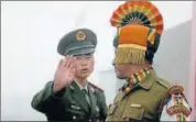  ?? AFP FILE ?? A Chinese and an Indian soldier at the Nathu La border.