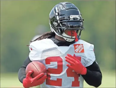  ?? Ap-john Bazemore, File ?? When Atlanta Falcons coach Dan Quinn calls running back Devonta Freeman a “multiplier” he is talking about Freeman making every other player on the offense better. That makes Freeman’s health an obvious key after he was limited by injuries to two games in 2018.