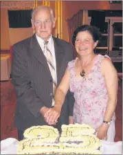  ?? ?? Cutting the cake at the 25th anniversar­y were twinning committee presidents, John Guinevan and Josianne Calvez.