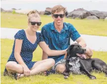  ??  ?? Matt and Laura Brinums with their dog Louie.