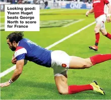  ??  ?? Looking good: Yoann Huget beats George North to score for France