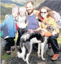  ??  ?? Sophie and Lizzy Cox on their climb with mum and dad and dog Archie