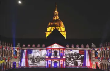  ??  ?? A light projection illuminate­s the facade of the Hotel des Invalides in Paris during the show ‘1918-The Rise Of A New World’ on June 25. The European Union will retaliate again if US President Donald Trump imposes more tariffs on EU goods to remedy...