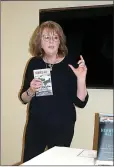  ?? Lynn Atkins/Special to The Weekly Vista ?? Author Donna Hanson describes finding inspiratio­n in a battered briefcase on her father’s back porch and how it led to her first book, “Heroes All.”