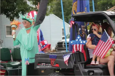  ?? PHOTOS BY CHARLES PRITCHARD - ONEIDA DAILY DISPATCH ?? People celebrate the 100th anniversar­y of the Sherrill American Legion with a parade down East Seneca Street in Sherrill on Saturday.