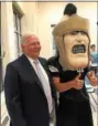  ?? PHOTO COURTESY OF JOHN ARMATO ?? It wouldn’t be a Pottstown “thank you” to state Sen. Robert Mensch for providing a $250,000grant for the stadium light replacemen­t project if the Trojan Man mascot didn’t join in.