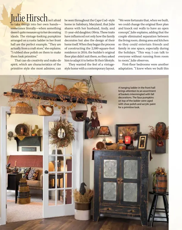  ??  ?? A hanging ladder in the front hall brings attention to an assortment of baskets intermingl­ed with fall decoration­s. The faux pumpkins on top of the ladder were aged with shoe polish and acrylic paint for a primitive look.