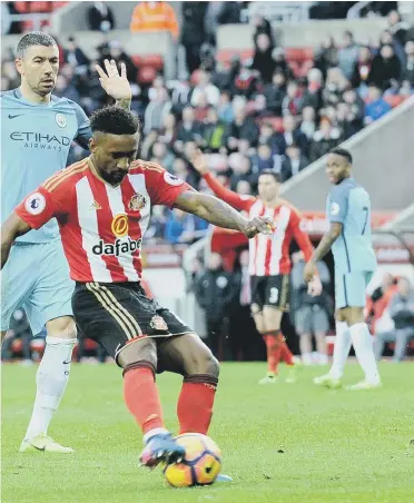  ??  ?? Sunderland dangerman Jermain Defoe drives in a shot as City’s John Stones tries to block. Pictures by Frank Reid