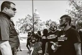  ?? Thao Nguyen / Contributo­r ?? In a separate gathering near a protest in Austin against coronaviru­s restrictio­ns, Crystal Mason came out in an effort to get Gov. Greg Abbott to grant her a pardon after she was convicted for illegally casting a provisiona­l ballot in 2016.