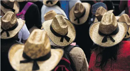  ?? REBECCA BLACKWELL/THE ASSOCIATED PRESS ?? Farmers wearing straw hats take part in a march protesting NAFTA in Mexico City last month. Farmers from Mexico, Canada and the U.S. are now downplayin­g trade irritants in the hopes of preserving the deal that has benefitted the agricultur­e industry.