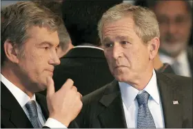  ?? VADIM GHIRDA - THE ASSOCIATED PRESS ?? Ukraine’s President Viktor Yushchenko talks with President George W. Bush, at the NATO Summit conference in Bucharest on April 3, 2008. NATO returns today to repeat its vow that Ukraine will be able to join it.