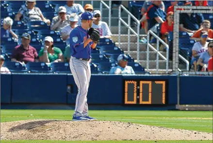  ?? GETTY IMAGES/TNS 2019 ?? The pitch clock, such as the one facing Eric Hanhold, is among the changes that have been tested in the minor leagues and will implemente­d in spring training this year. In addition, the number of pitchers’ unsuccessf­ul pickoff attempts will be limited.