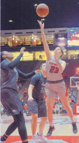  ?? GREG SORBER/JOURNAL ?? Jaedyn De La Cerda (23) takes a close-range shot against Eastern New Mexico in Sunday afternoon’s exhibition game in the Pit. She played a team-high 22 minutes and had 11 points.