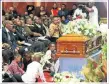  ??  ?? Parents of Thoriso Themane pay their last respects to their son who was stabbed by pupils last month