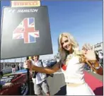  ?? AFP ?? A pit girl holds a sign for Mercedes driver Lewis Hamilton at the United States Grand Prix on November 18.