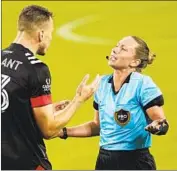  ?? Mark Humphrey Associated Press ?? D. C. UNITED defender Frédéric Brillant argues with referee Tori Penso in recent MLS game.