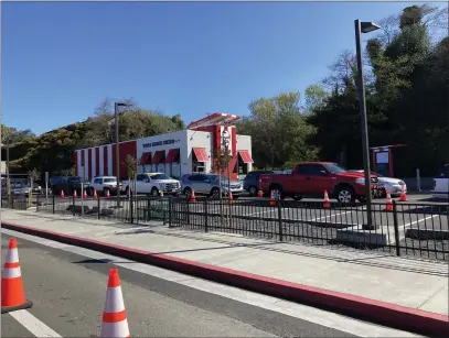  ?? RUTH SCHNEIDER — THE TIMES-STANDARD ?? Traffic is lined up outside of the newly opened KFC in Eureka on Thursday morning. Local law enforcemen­t says there has not been an increase in collisions, but there have been more “traffic issues.”