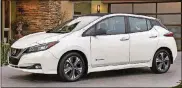  ?? NISSAN NORTH AMERICA INC. VIA AP COURTESY OF ?? This photo provided byNissan shows the 2018Nissan Leaf, a redesigned­versionof oneof themost popular electric vehicles ever produced. It goes on sale in early 2018, with a starting price just under $31,000.