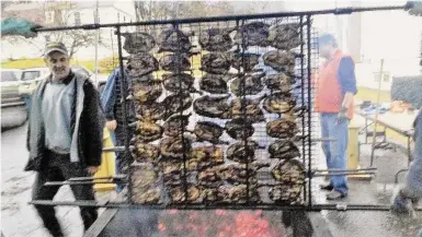  ?? Contribute­d photos ?? The Harwinton Chicken Barbecue returns for its 60th year on Feb. 25. Pictured is a grill rack filled with chickens from the 2019 event.