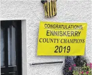  ?? PHOTOS: ARTHUR CARRON ?? Shock: Members of the Enniskerry team on the truck before the fall (top); a banner in the village (above left) marking the team’s success; and (above right) councillor Rory O’Connor.