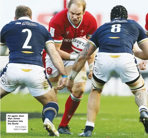  ?? PICTURES: Getty Images ?? Fit again: Alun Wyn Jones thunders into the Scots