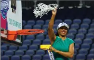  ?? (AP/Chuck Burton) ?? Notre Dame women’s basketball Coach Niele Ivey waves the net Sunday after her team defeated NC State 55-51 in the ACC championsh­ip game in Greensboro, N.C. “This team is the type of team that does whatever we need to help us win,” Ivey said.