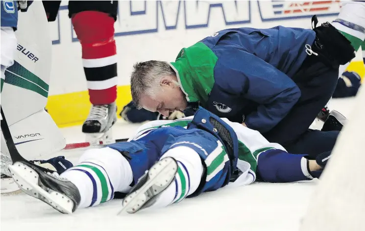  ?? — ASSOCIATED PRESS FILES ?? Canucks defenceman Philip Larsen was knocked unconsciou­s by a hit from Taylor Hall on Dec. 6, but has since recovered and returned to the lineup.