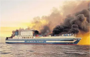  ?? LAZOS MANTIKOS THE ASSOCIATED PRESS ?? Smoke billows from the Euroferry Olympia in the Ionian Sea near the island of Corfu, Greece, on Friday. Along with nearly 300 passengers, the vessel was carrying more than 153 trucks
and 32 cars.