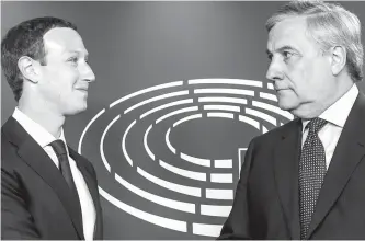  ?? AP-Yonhap ?? European Parliament President Antonio Tajani, right, welcomes Facebook CEO Mark Zuckerberg upon his arrival at the EU Parliament in Brussels on Tuesday.