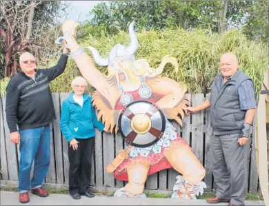  ??  ?? Ross MacDonald (Dannevirke Community Board), Pat Herbert (artist) and John Robertson (Menz Shed) pose by the Viking in Pat’s yard before being re-erected at the Dannevirke Informatio­n Centre.