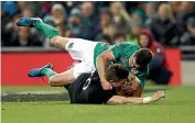  ??  ?? Johnny Sexton arrives too late to prevent Beauden Barrett scoring a try during the All Blacks 2016 victory in Dublin.