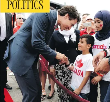  ?? JUSTIN TANG / THE CANADIAN PRESS FILES ?? Prime Minister Justin Trudeau greets members of a Syrian refugee family on Canada Day in 2016.