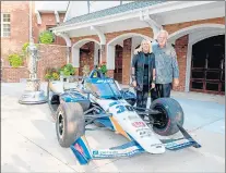  ?? PHOTO PROVIDED BY ANNA THIELEN ?? Mike Lanigan and his wife Mary Kay stand beside the Indy 500-winning race car.