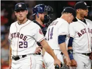  ?? Brett Coomer / Staff photograph­er ?? Astros starting pitcher Corbin Martin, left, exits after allowing four runs against the White Sox.