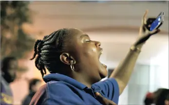  ??  ?? A protester shouts slogans during a protest in Charlotte, North Carolina, this week. Protesters took to the streets for the third consecutiv­e night to protest the fatal shooting African-American Keith Lamont Scott by police officers on Tuesday.