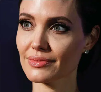  ?? BRENDON THORNE/GETTY IMAGES ?? Angelina Jolie says she often thought of her sons while filming Unbroken, and was careful keeping the film to a PG-13 rating.