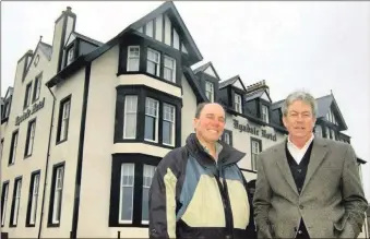  ?? ?? In 2012: David Southworth, president and CEO of Southworth Developmen­t LLC, right, with Marc Wexler, project executive, outside the newly refurbishe­d Ugadale Hotel.