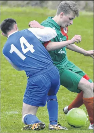  ?? Picture: Paul AmosFM4567­969 ?? Bromley Green (blue) attempt to win the ball back off Lydd Town 3rds