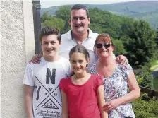  ??  ?? Happier times Kevin Courtie MBE pictured with wife Dorothy and children Andrew and Laura