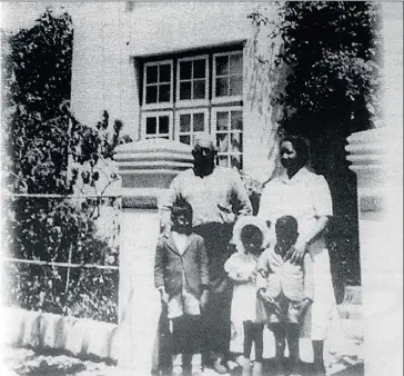  ??  ?? THE GOOD OLD DAYS: Built in 1927, this home at 97 Ryneveld Street in “Die Vlakte”, Stellenbos­ch, was the property of Simon Cupido, seen outside it with his wife Aletta and their grandchild­ren Putty, Joan and Edgar.