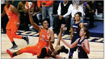  ?? AP/BILL SIKES ?? Alyssa Thomas (center) of the Connecticu­t Sun had 17 points, 11 assists and 8 rebounds to lead the Sun to a 90-86 victory over the Washington Mystics to even the WNBA Finals at 2-2. Game 5 is set for Thursday night in Washington, D.C.