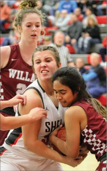  ?? Photo courtesy of Greatsport­shots.com ?? Eight different players scored during Shelby’s 46-12 junior varsity girls basketball victory against Willard Thursday evening.
The Lady Whippets boosted their record to 8-0 on the season and led throughout by margins of 13-3, 23-9 and 46-11.
Aleigha Thauvette paced the SHS girls with eight points and was backed up by Alyssa Booker (7), Trinity Baker (7), Lexi Mohn (6), Serena Ramsey (5), Charlie Niese (5), Kaylin Mahon (4) and Eve Schwemley (4).
Leading Shelby in rebounds were Schwemley and Sophia Long with seven and five, respective­ly.
The next game for the Whippet reserves is Thursday, Dec. 30, at Clear Fork.
Shelby’s Alexis Booker battles for possession of the ball with an opponent from Willard Thursday.