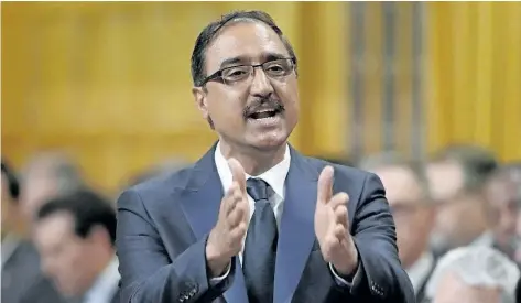  ?? ADRIAN WYLD/THE CANADIAN PRESS ?? Infrastruc­ture Minister Amarjeet Sohi responds to a question this week in the House of Commons on Parliament Hill in Ottawa. The Trudeau government is telling provinces and territorie­s that billions in new infrastruc­ture money won’t flow from federal...