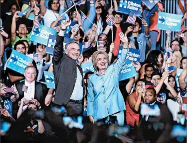  ?? GUSTAVO CABALLERO/GETTY ?? Democratic hopeful Hillary Clinton and her No. 2 pick, Virginia Sen. Tim Kaine, campaign together in Miami on Saturday.