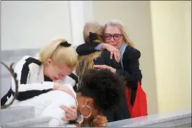  ?? ASSOCIATED PRESS ?? Accuser Lili Bernard, foreground, is consoled by grief counselor Caroline Heldman left, as accuser Victoria Valentino, right, is comforted outside the courtroom after Bill Cosby was found guilty in his sexual assault retrial Thursday at the Montgomery...