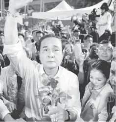  ??  ?? Prayut Chan-o-cha attends the Palang Pracharath Party’s party campaign rally in central Bangkok, Thailand. — Reuters photo