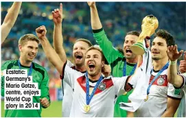  ??  ?? Ecstatic: Germany’s Mario Gotze, centre, enjoys World Cup glory in 2014