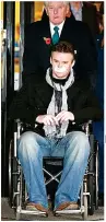  ?? ?? ANGUISH Russell leaving hospital after 2007 brain op